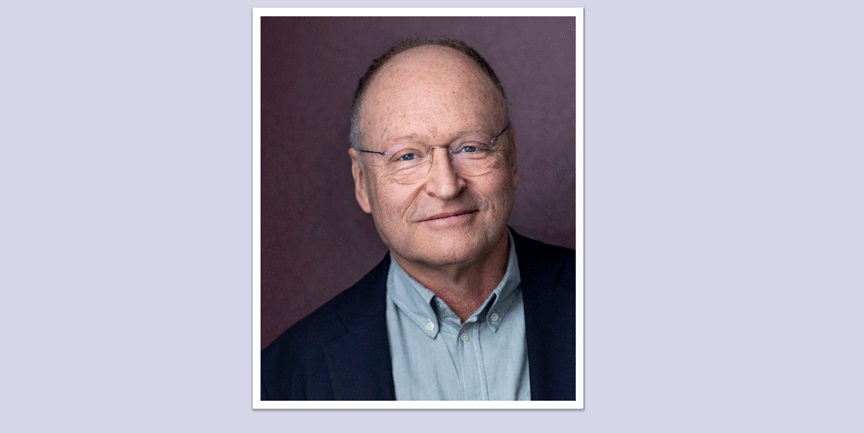 Mårten Blomkvist, man med snaggat tunt hår, glasögon och blå skjorta.